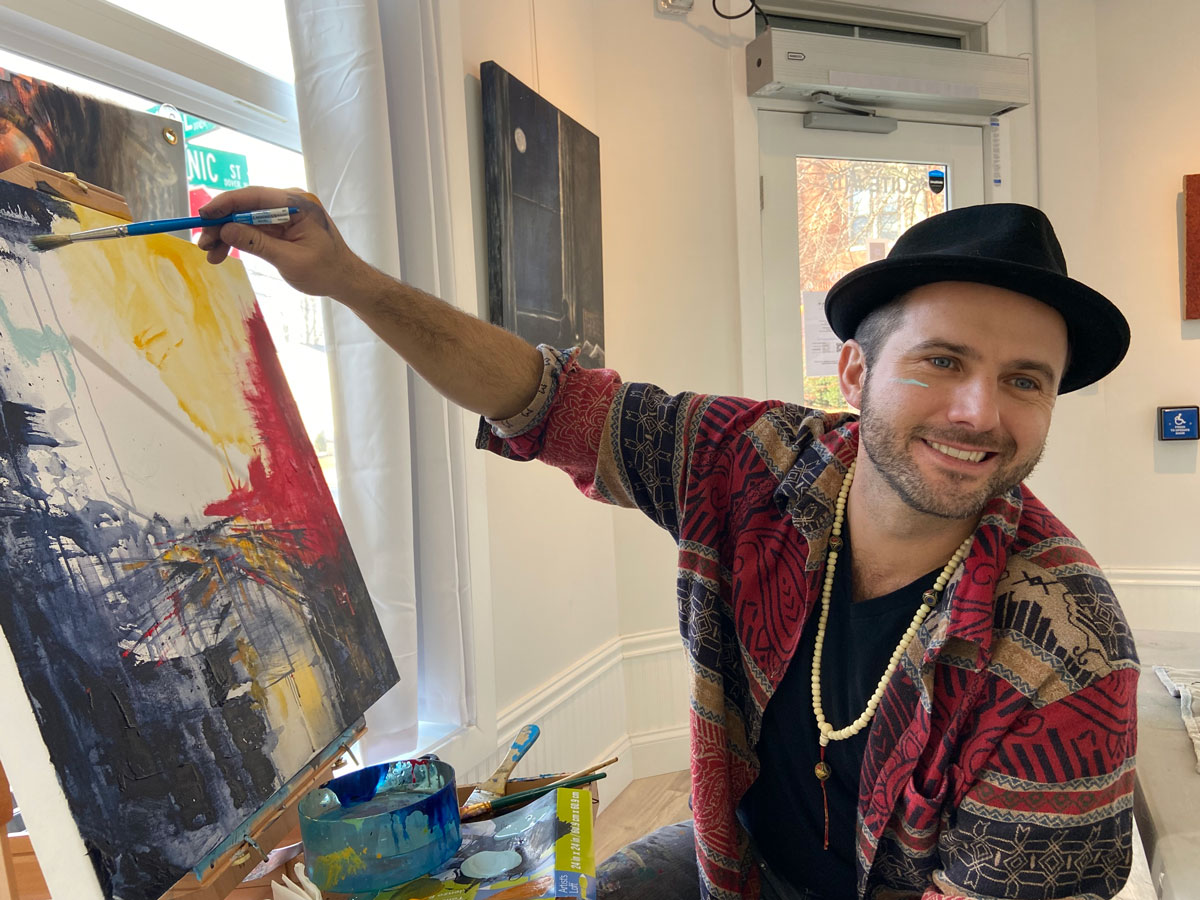 Emily holding her painting