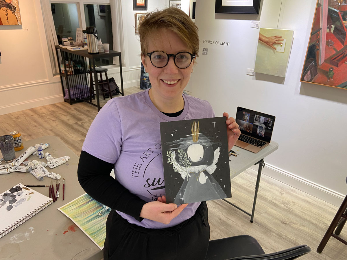 Emily holding her painting